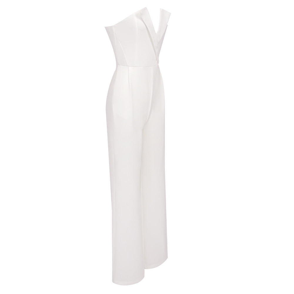 Elegant white jumpsuit with a sheer pearl-embellished bodice and wide-leg pants